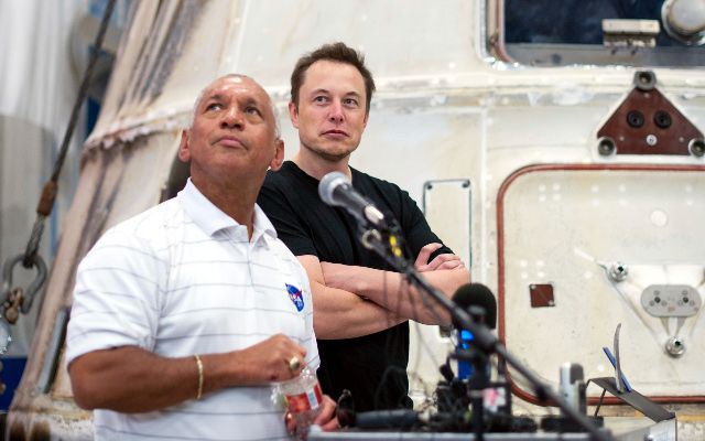 NASA Administrator Charles Bolden (L), and SpaceX CEO and Chief Designer Elon Musk view the historic Dragon capsule that returned to Earth on May 31 following the first successful mission by a private company to carry supplies to the International Space Station at the SpaceX facility in McGregor, Texas, June 13, 2012. Bolden and Musk also thanked the more than 150 SpaceX employees working at the McGregor facility for their role in the historic mission.