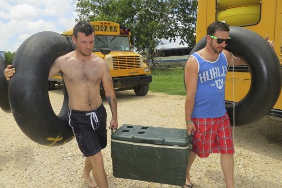 Corey Johnson (left) and Travis Bethany prepare to hit the water at Cool River Ranch about three weeks before Bethany planned to run with the bulls in June.