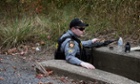 A trooper patrols the woods along Monroe township in search for Eric Frein.