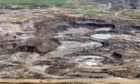 An aerial view of an open cast mine near Fort McMurray, Alberta, Canada, which is being used to extract oil from the Athabasca tar sands fields.