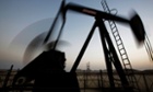 An oil pump works at sunset in the desert oil fields of Sakhir, Bahrain. Photo: AP/Hasan Jamali