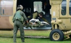 Israeli soldiers in Beersheba, Israel, unload a comrade who was wounded in a shootout on the border with Egypt.