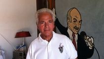 Noel Blanc in front of a mural of his dad, Mel Blanc