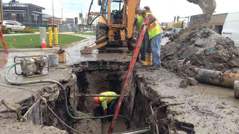 A water maintenance crew works on leaky infrastructure in Skokie, a Chicago suburb. The area loses almost 22 billion gallons of water a year because of ailing infrastructure.