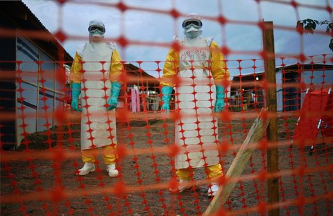 Doctors Without Borders health workers wearing protective clothing to shield against Ebola at a clinic in Kailahun, Sierra Leone.