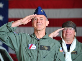 U.S. Coast Guard Commandant Admiral Paul Zukunft and former Vice Commandant Vice Admiral John P. Currier salute during a U.S. Coast Guard ancient albatross change of watch ceremony.