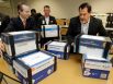 Jared Woodfill, left, David Welch, right, and others with a group seeking to repeal Houston's equal rights ordinance delivered boxes of signatures to the office of the Houston city secretary on July 3.