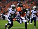 Wide receiver Emmanuel Sanders #10 of the Denver Broncos makes a catch for a 31 yard second quarter touchdown ahead of cornerback Richard Marshall #31 of the San Diego Chargers during a game at Sports Authority Field at Mile High on October 23, 2014 in Denver, Colorado.  (Photo by Doug Pensinger/Getty Images)