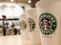 NEW YORK - AUGUST 5:  Beverage cups featuring the logo of Starbucks Coffee are seen in the new flagship store on 42nd Street August 5, 2003 in New York City. The Seattle-based coffee company has emerged as the largest food chain in the Manhattan borough of New York with 150 outlets.  (Photo by Stephen Chernin/Getty Images)