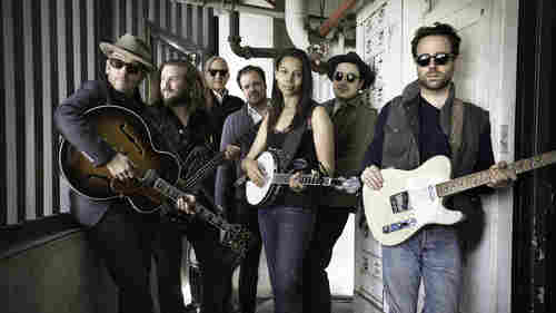 To create Lost on the River: The New Basement Tapes, T Bone Burnett (second from left) assembled the talents of Elvis Costello, Jim James, Jay Bellerose, Rhiannon Giddens, Marcus Mumford and Taylor Goldsmith.