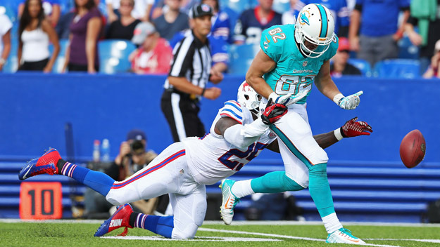 ORCHARD PARK, NY - SEPTEMBER 14: Brian Hartline #82 of the Miami Dolphins has a pass broken up by Da'Norris Searcy #25 of the Buffalo Bills during the second half at Ralph Wilson Stadium on September 14, 2014 in Orchard Park, New York.