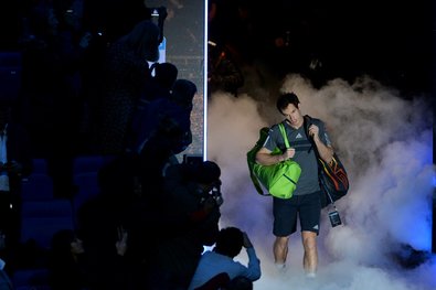 Andy Murray walked through dry ice before his match Tuesday against Milos Raonic at the ATP World Tour Finals. Murray won, 6-3, 7-5.