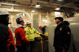 Aboard the Sturgis: US Army Corp of Engineers project managers Brenda Barber (flag safety hat) and Hans Honerlah (yellow jacket)