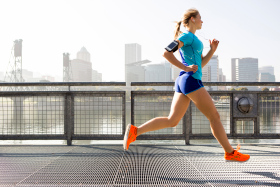 A young girl running for exercise.