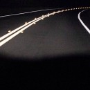 Roadway at night with bright reflective pavement markings