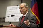 Attorney General Greg Abbott indicates his willingness to sue President Obama on immigration during a press conference Nov. 24, 2014.