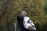 An environmental activist dressed as a lobbyist, his hands covered in coal, protested in Brussels in October. Europe has agreed to cut greenhouse gas emissions by 40 percent from 1990 levels by 2030.