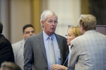 State Rep. Charlie Geren, R-Fort Worth, talks with colleagues on the floor during discussion on school finance Friday afternoon May 27, 2011.