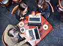 Laptop users in cafe