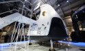 SpaceX's new seven-seat Dragon V2 spacecraft (L) is seen at a press conference to unveil the new spaceship, in Hawthorne, California, May 29, 2014.  (ROBYN BECK/AFP/Getty Images)