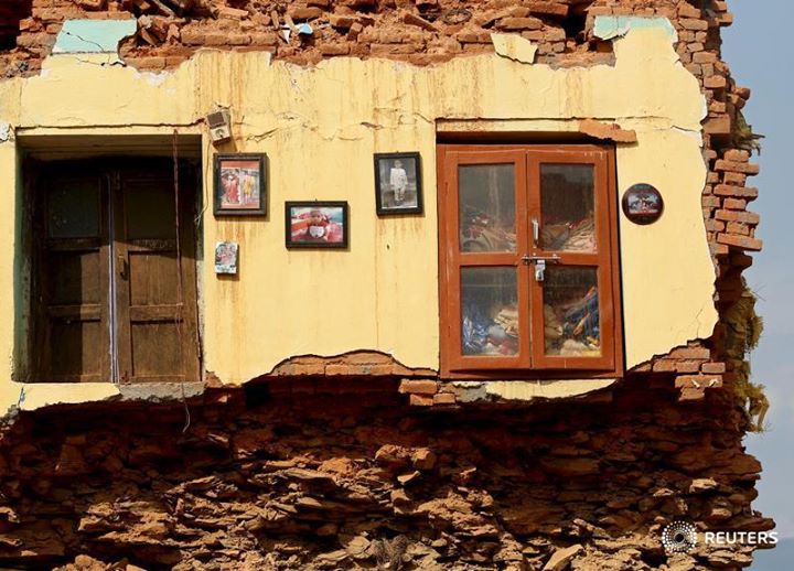 'Framed pictures are seen hanging from the wall of a house damaged by earthquakes in Sindhupalchowk district, Nepal. REUTERS/Ahmad Masood 

Our Editor's Choice gallery takes you around the world: http://reut.rs/1cYlkBe'