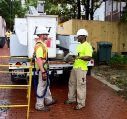 Workers install the final LED streetlight for DC's EECBG-funded energy efficient lighting upgrade. | Energy Department photo, credit Chris Galm.