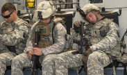 Service members sneak in sleep where they can. Here, Army National Guard soldiers catch a few minutes onboard a C-17 Globemaster en route to Fort Hunter Liggett in central California. The mission was part of the 349th Air Mobility Wing's Air Force Specialty Code Training Weekend providing reservists with hands-on, realistic training that helps to hone their skills. U.S. Air Force Photograph by Heide Couch/Released