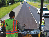 photograph showing a roadway being repaved