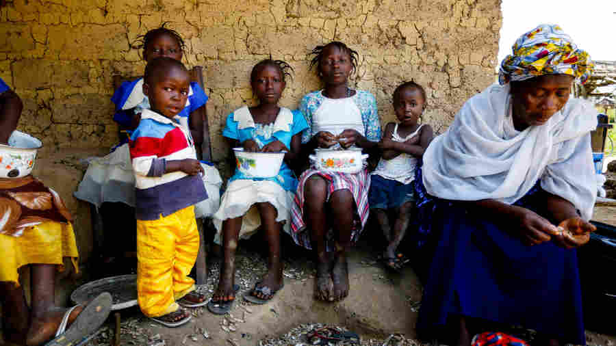 Mamuedeh Kanneh, right, was married to the man who brought Ebola to Barkedu, Liberia, a village of about 6,000. He died of the virus. She now cares for her children as well as children who lost their parents to the disease.