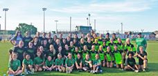 'Here is a great picture from our alumni game: alumni, current team and ball girls. Thank you to all who came out, especially the former players who took to the field and went toe-to-toe with the Mean Green.'