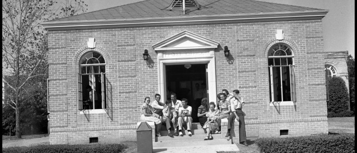 UNTA_U0458-098-713-02 Students pose on the steps of the Post Office.  The structure was built in 1939 and was used by the Post Office until the first Union Building opened after World War II.