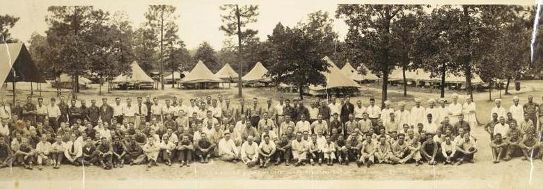 This panoramic group photograph of members of the Pineland Civilian Conservation Corps (CCC) camp in 1933 shows a typical CCC camp as described in numerous reminiscences captured in the Oral History program. The photograph was taken during one of Connie Ford McCann's two six-month tours in the Civilian Conservation Corps located in Pineland, Texas during the Great Depression.