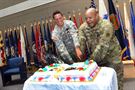 U.S. Army Reserve Staff Sgt. Angel Olivo, Information Technology Sergeant, 85th Support Command, and Sgt. 1st Class Kyle Glenn, Physical Security Sergeant, 85th Support Command, cut their farewell cake together on June 17, 2016. Both Glenn and Olivo have been integral soldiers within the command and will truly be missed. 
(Photo by Sgt. 1st Class Anthony L. Taylor)