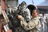 A Soldier from 1-1CAV out of Fort Hood, TX loads his ruck sack during airfield operations supported by 19th Expeditionary Sustainment Command.  

