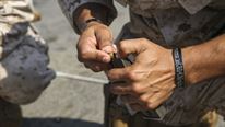 A Marine with 22nd Marine Expeditionary Unit loads ammunition during a pistol qualification aboard the amphibious dock landing ship USS Whidbey Island, Oct. 15, 2016. 22nd MEU, deployed with the Wasp Amphibious Ready Group, is maintaining regional security in the U.S. 5th Fleet area of operations.