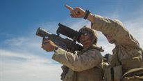 U.S. Marine Corps Cpl. Brandon M. Stewarts, right, and Lance Cpl. Pierre Ponce, low altitude air defense (LAAD) gunners with 2nd LAAD, Battery B demonstrate the use of a FIM-92 Stinger during a ground based air defense exercise at Site 50, near Wellton, Ariz., Oct. 6, 2016. Weapons and Tactics Instructor (WTI) course 1-17 is a seven week training event hosted by Marine Aviation Weapons and Tactics Squadron One (MAWTS-1) cadre which emphasizes operational integration of the six functions of Marine Corps aviation in support of a Marine Air Ground Task Force. MAWTS-1 provides standardized advanced tactical training and certification of unit instructor qualifications to support Marine aviation Training and Readiness and assists in developing and employing aviation weapons and tactics. 