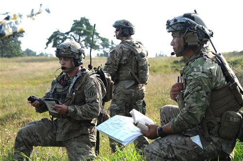 (L to R) U.S. Air Force Senior Airman Thomas Reeves, U.S. Air Force Staff Sgt. Jerrod Mowery and U.S. Air Force Staff Sgt. Jermain Capalos scan the battlefield for enemy activity in order to accurately call in an air strike during lane training at the Hohenfels, Germany Training area at the Joint Multinational Readiness Center, Hohenfels, Germany Aug. 31, 2016, for Exercise Combined Resolve VII, which is a 7th Army Training Command, U.S. Army Europe-directed exercise, taking place at the Grafenwoehr and Hohenfels Training Areas, Sep. 2 to Sept. 15, 2016. The exercise is designed to train the Army’s regionally allocated forces to the U.S. European Command. Combined Resolve VII includes more than 3,500 participants from 16 NATO and European partner nations. (U.S. Army photo by Staff Sgt. David J. Overson, 301st Public Affairs Detachment)