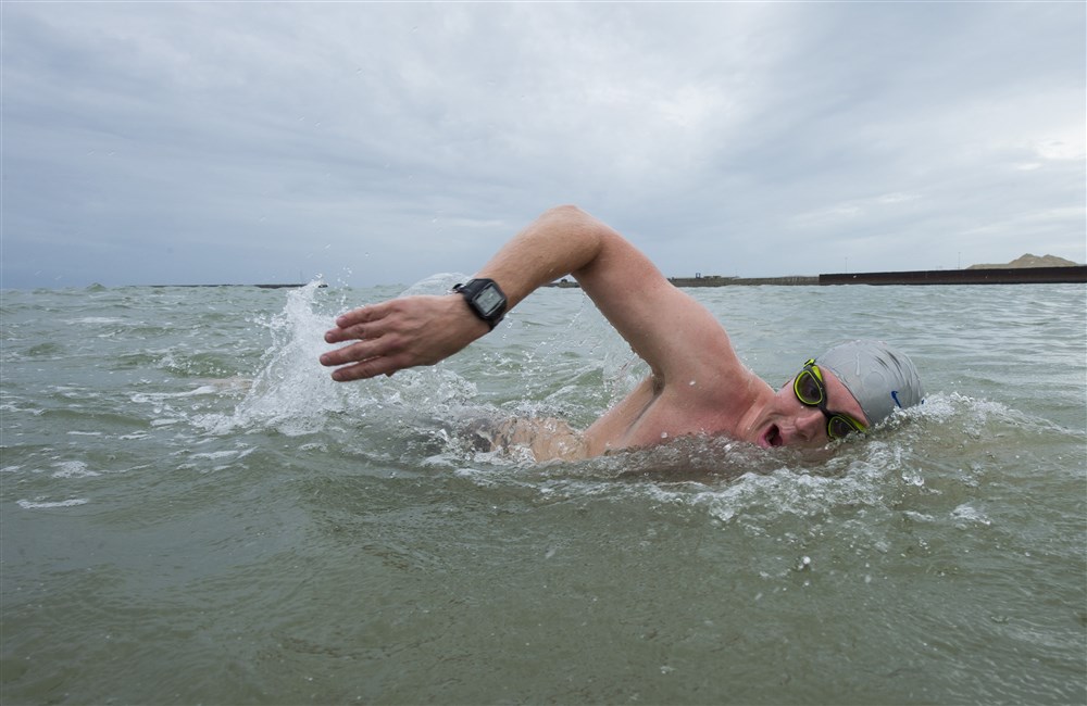 U.S. Air Force Major Casey Bowen, a dermatologist with the 59th Medical Wing, swims in Dover Harbor, United Kingdom during a practice swim on September 25, 2016. Maj. Bowen and Maj. Ritchie traveled to the United Kingdom to swim across the English Channel from Dover Harbor to the coastline of France. (DoD News photo by Tech. Sgt. Brian Kimball)
