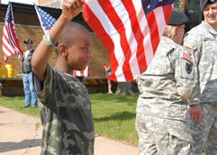 Young child waving an American flag