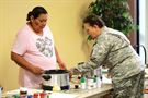 LOWER BRULE, S.D. -- U.S. Army Reserve Maj. Elizabeth Rodriguez, chief nutritionist with the 1207th U.S. Army Hospital, instructs Bessie Loudner, a local resident with Type 2 Diabetes, during a healthy cooking demonstration July 20, 2016. Rodriguez conducted the class during an Innovative Readiness Training mission on the Lower Brule Reservation located 61 miles southeast of Pierre, S.D. IRT allows Soldiers to use their skill set in real-world environments that that positively impact communities. Rodriguez used the session to teach locals about managing their diabetes through diet and nutrition. (U.S. Army Reserve photo by Spc. David Alexander) 