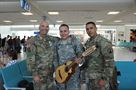 Building unit morale is a task that Staff Sgt. Nathanael Rivera (middle) brings upon himself. During previous deployments he was known for boosting morale by playing his guitar. “I enjoy playing the guitar for myself, to learn, and for the Soldiers to relieve stress,” said Rivera. “This time I brought a different instrument to make it more interesting and less mundane for the Soldiers.” Along with his Army issued equipment Rivera will travel with his cuatro guitar, which is the national instrument of Puerto Rico, on September 28 at Luis Mu&#241;oz Marin Airport in San Juan, Puerto Rico.