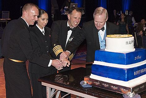 The most junior Sailor in the room joins Secretary of the Navy Ray Mabus, Chief of Naval Operations (CNO) Adm. John Richardson and Master Chief Petty Officer of the Navy (MCPON) Steven Giordano to cut birthday cake, honoring the Navy's 241st birthday at the National Capital Region Navy Ball.  U.S. Navy photo by Chief Petty Officer Elliott Fabrizio (Released)  161007-N-ES994-046