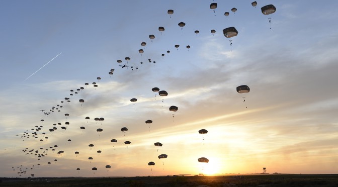 Several C-130J Super Hercules assigned to the 317th Airlift Group at Dyess Air Force Base, Texas, help U.S. Army and British paratroopers perform a static line jump at Holland Drop Zone in preparation for Combined Joint Operational Access Exercise 15-01 at Fort Bragg, N.C., April 11, 2015. This was the largest exercise of its kind held at Fort Bragg in nearly 20 years and demonstrated interoperability between the U.S. Air Force, Air National Guard, Royal Air Force, U.S. Marine Corps, U.S. Army and British Army. (U.S. Air Force photo/Staff Sgt. Sean Martin)