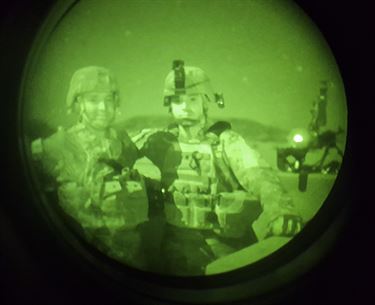 Sgt. Christopher Bigelow (left) and Spc. Jordan Fitzgerald (right), Army Reserve Soldiers with the 316th Sustainment Command (Expeditionary), based out of Coraopolis, Pa., pose after firing the M240B machine gun during a night qualification at Fort Hood, Tx., Oct. 10, 2016. This is to prepare the Soldiers of the 316th during their predeployment training. (U.S. Army photo by Staff Sgt. Dalton Smith)