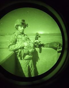 Staff Sgt. Dalton Smith, public affairs noncommissioned officer in-charge with the 316th Sustainment Command (Expeditionary), poses after firing the M240B machine gun during a night qualification at Fort Hood, Tx., Oct. 10, 2016. This is to prepare the Soldiers of the 316th during their predeployment training. (U.S. Army photo by Sgt. Christopher Bigelow)