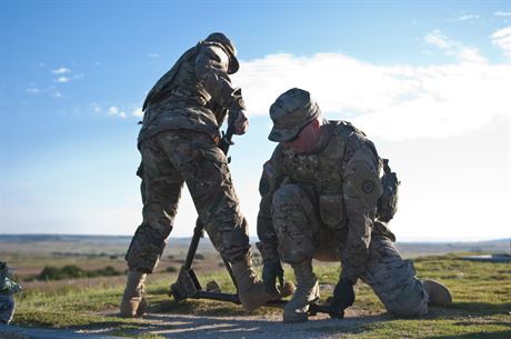 Staff Sgt. Christopher Lewis (right) and Sgt. Christopher Bigelow (left), Army Reserve Soldiers with the 316th Sustainment Command (Expeditionary), based out of Coraopolis, Pa., set up the tripod for a M2 machine gun before qualification at Fort Hood, Tx., Oct. 10, 2016. This is to prepare the Soldiers of the 316th during their predeployment training. (U.S. Army photo by Staff Sgt. Dalton Smith)