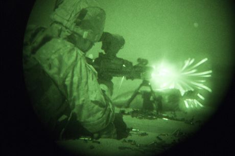 Spc. Jordan Fitzjerald, a military police officer with the 316th Sustainment Command (Expeditionary), an Army Reserve unit from Coraopolis, Pa., fires a M240B machine gun during a night qualification exercise as a part of the pre-deployment training 316th ESC Soldiers are receiving at Fort Hood, Tx., Oct. 10, 2016. (U.S. Army photo by Sgt. Christopher Bigelow)