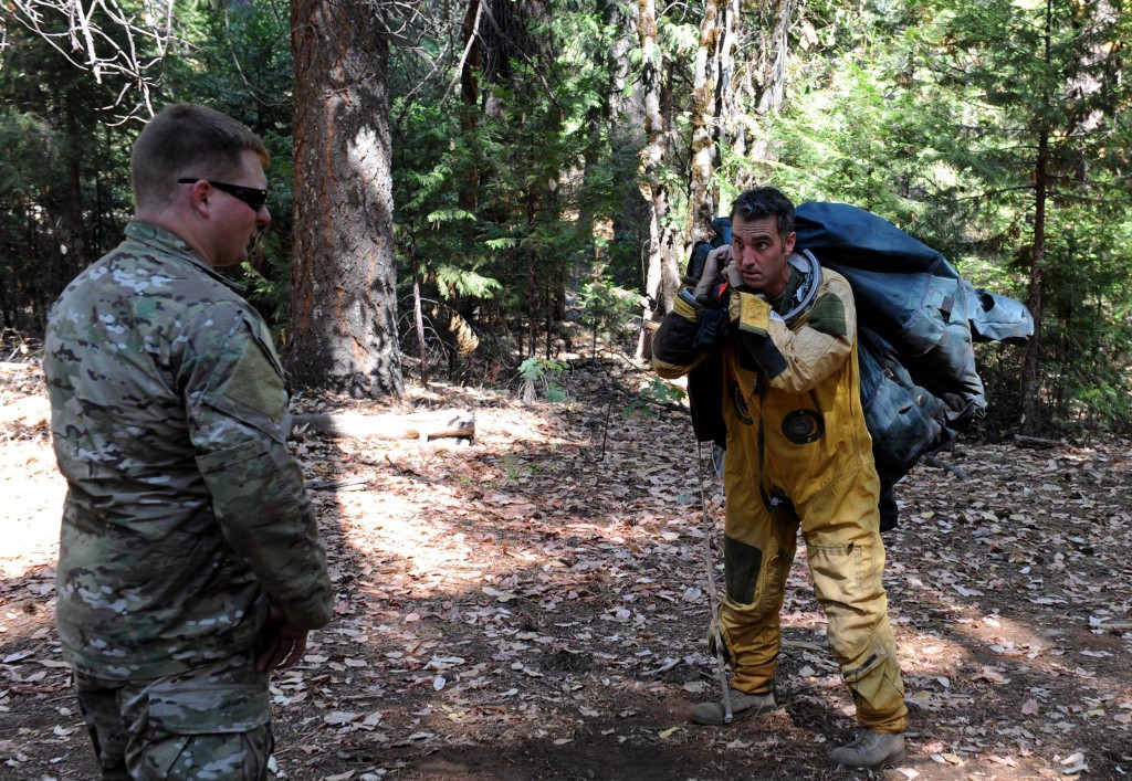 Staff Sgt. Alexander (left), 9th Operational Support Squadron, gives instructions to a U-2 pilot during a combat survival course in the Tahoe National Forest near Nevada City, California, Aug. 18, 2015. After attending Survival, Evasion, Resistance, and Escape school, Airmen are required refresher survival training every three to five years. (U.S. Air Force photo by Staff Sgt. Robert M. Trujillo/Released)