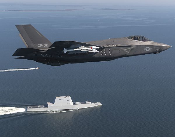 Aircraft CF-02, an F-35 Lightning II Carrier Variant attached to the F-35 Pax River Integrated Test Force (ITF) assigned to Air Test and Evaluation Squadron (VX) 23 completes a flyover of the guided-missile destroyer USS Zumwalt (DDG 1000).  U.S. Navy photo by Andy Wolfe (Released)  161017-N-VT045-001