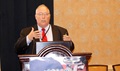 Dr. Merlin Robb with the U.S. Military HIV Research Program at Walter Reed Army Institute of Research addresses attendees at the Military Health System Research Symposium, Aug. 15 in Orlando, Florida. Robb was among the many researchers discussing one of the biggest threats facing the U.S. military: infectious disease.